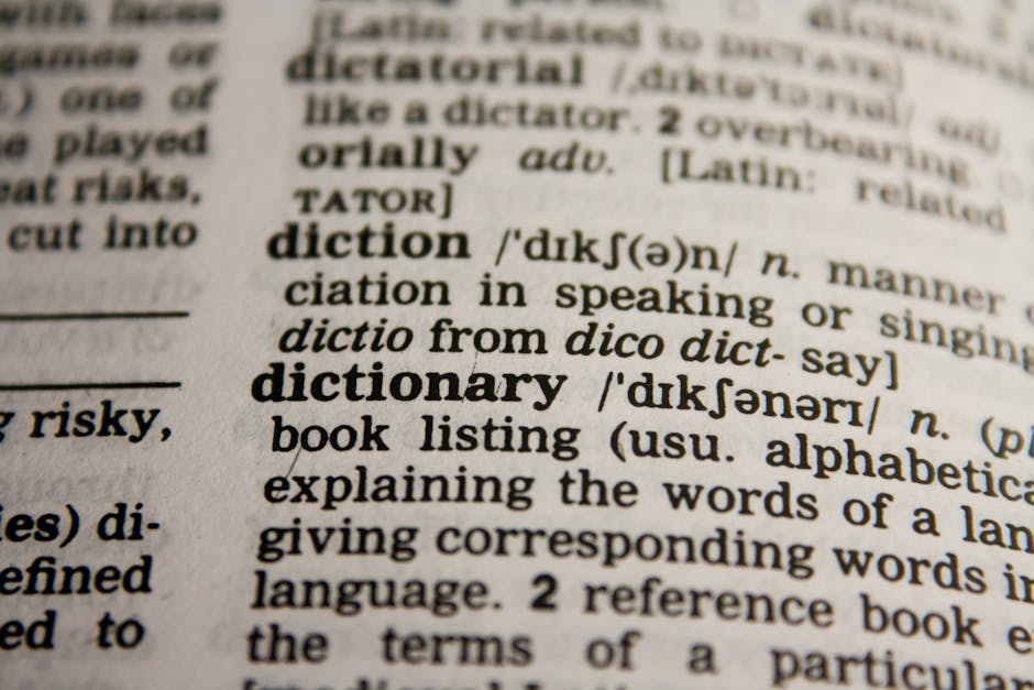 A close-up of a dictionary page, highlighting 'diction' and 'dictionary' entries, representing language for AI translation.