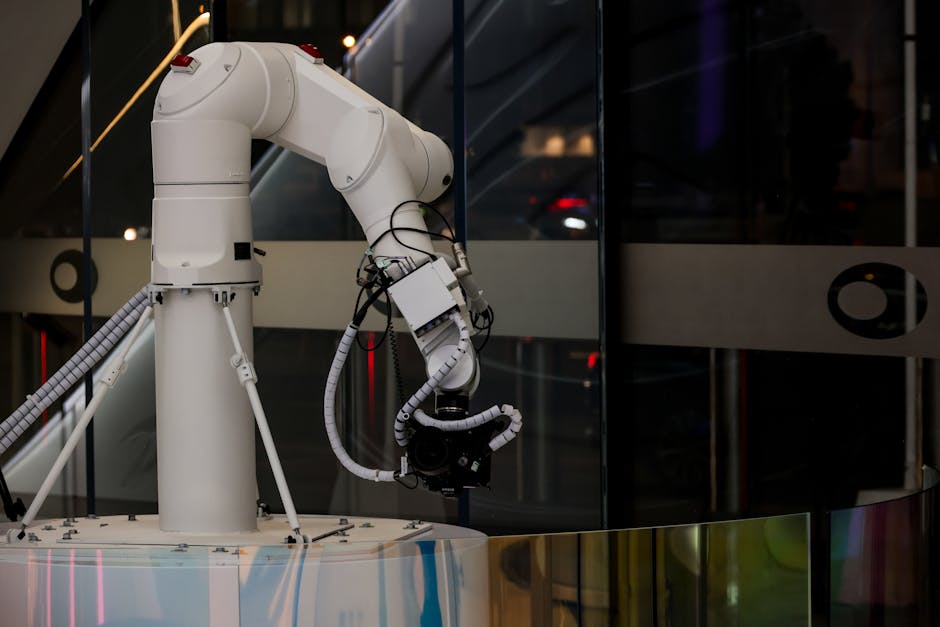 White industrial robotic arm with a camera, demonstrating AI-powered automation and efficiency in repetitive tasks.