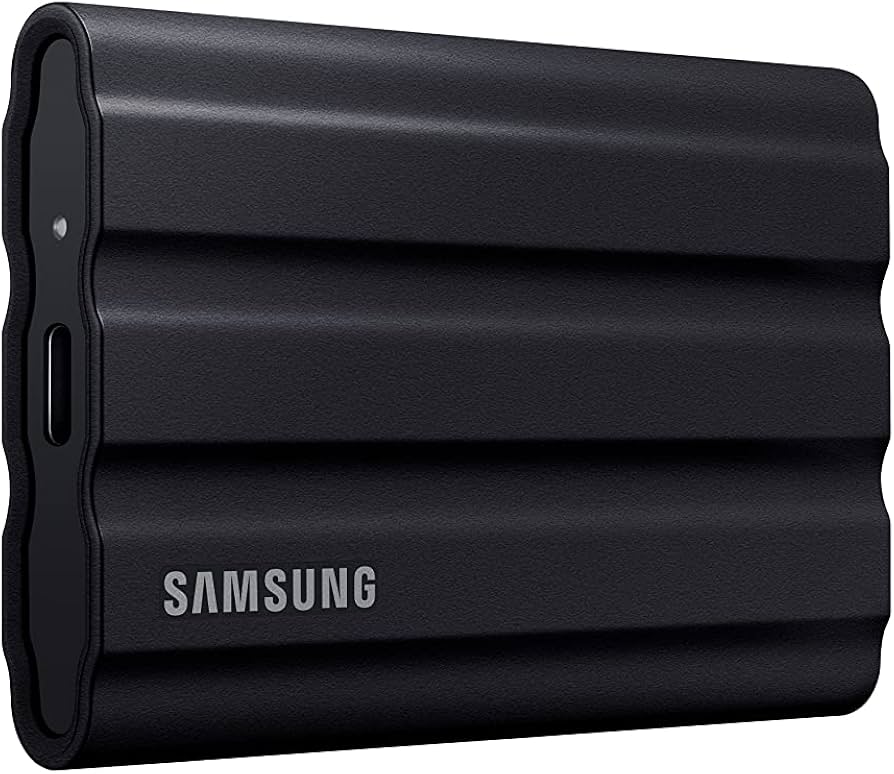 Black Samsung T7 Shield 2TB portable SSD with durable, ridged exterior.
