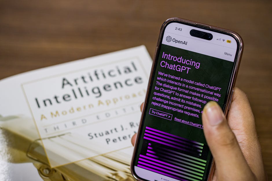 Person holding phone with ChatGPT screen; AI textbook visible. Highlights AI chatbot use for report writing and research.
