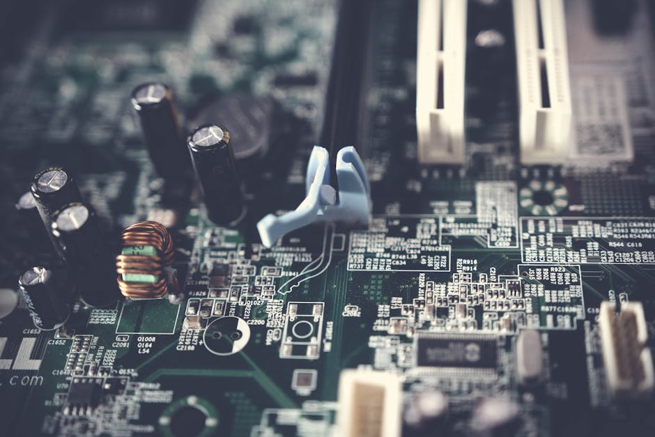 Close-up of a green circuit board with electronic components, symbolizing technology for AI and Python automation.