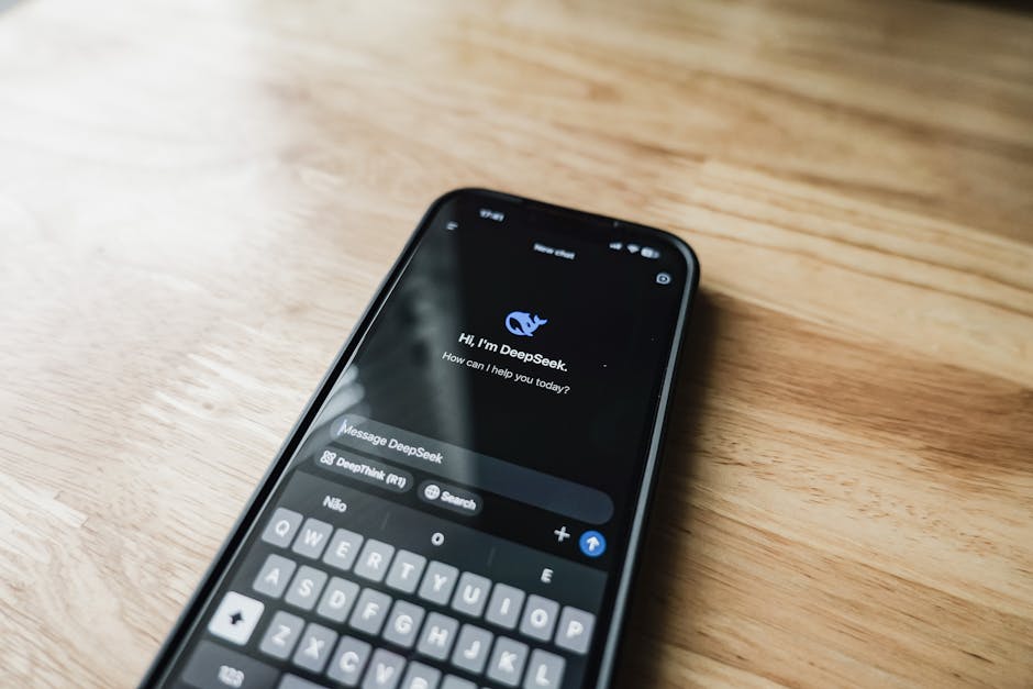 A smartphone shows the DeepSeek AI chat interface, a specialized tool aiding solo entrepreneurs with tasks.