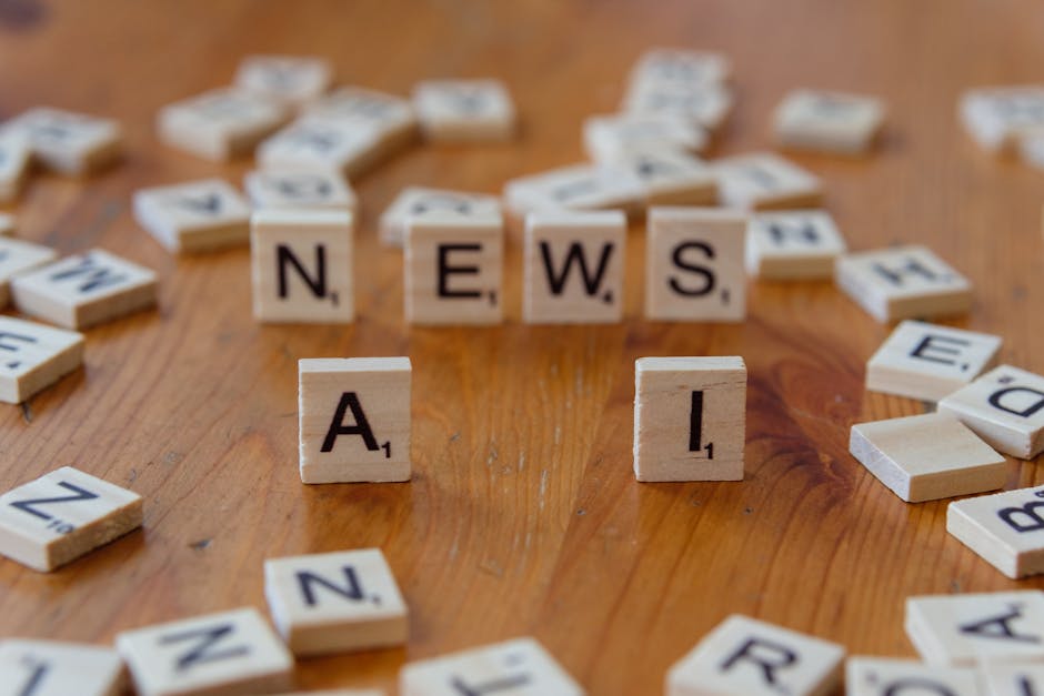 Scrabble tiles spelling 'NEWS' and 'A I' on a wooden table, symbolizing the latest in AI innovation and startup trends.