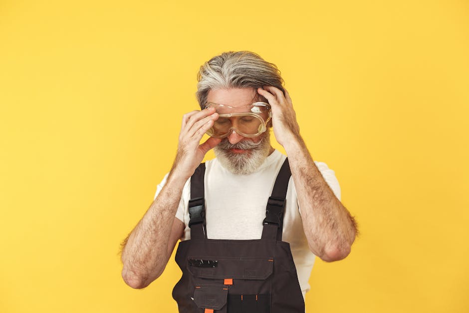 An experienced worker in safety goggles and overalls, symbolizing focus and precision for specialized AI solutions.