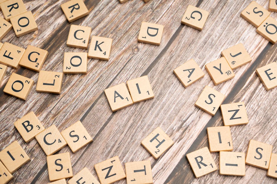 Wooden letter tiles, including 'AI', scattered on a wooden surface, symbolizing AI tools for fast and accurate transcription.