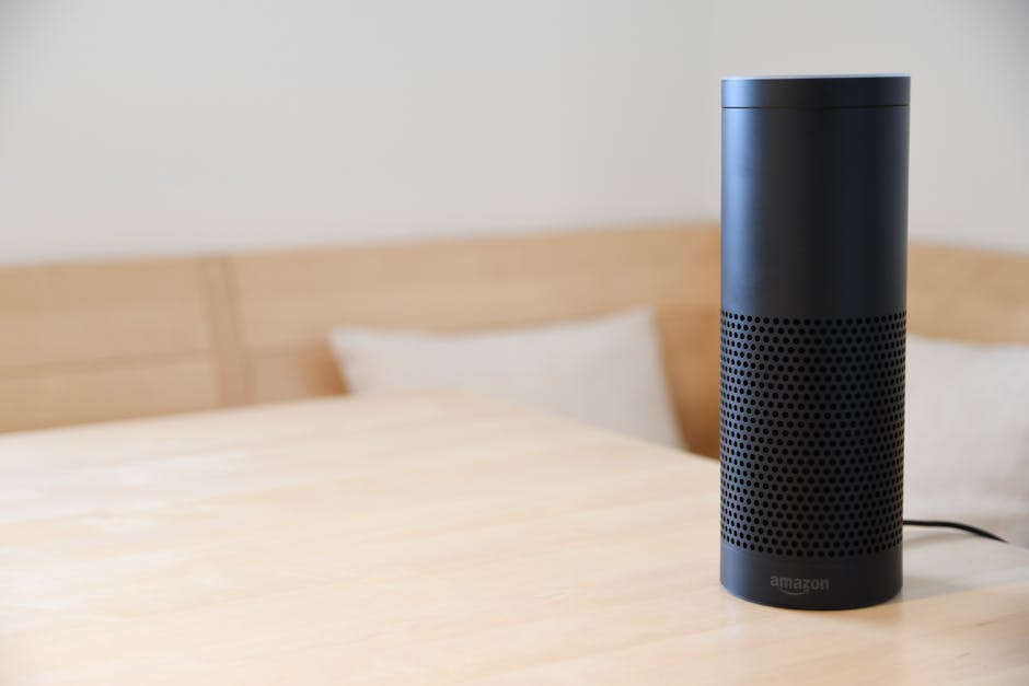 Black Amazon Echo smart speaker on a light wooden table, symbolizing AI for smarter and safer home automation.