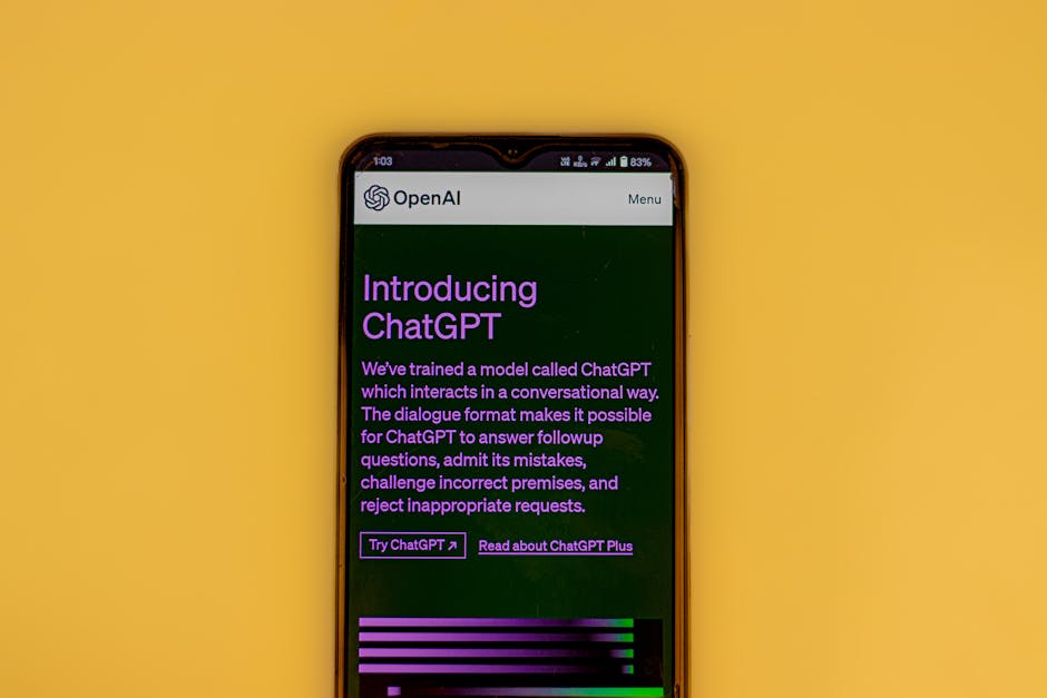 A smartphone shows OpenAI's ChatGPT interface on a yellow background, highlighting AI tools for digital tasks.