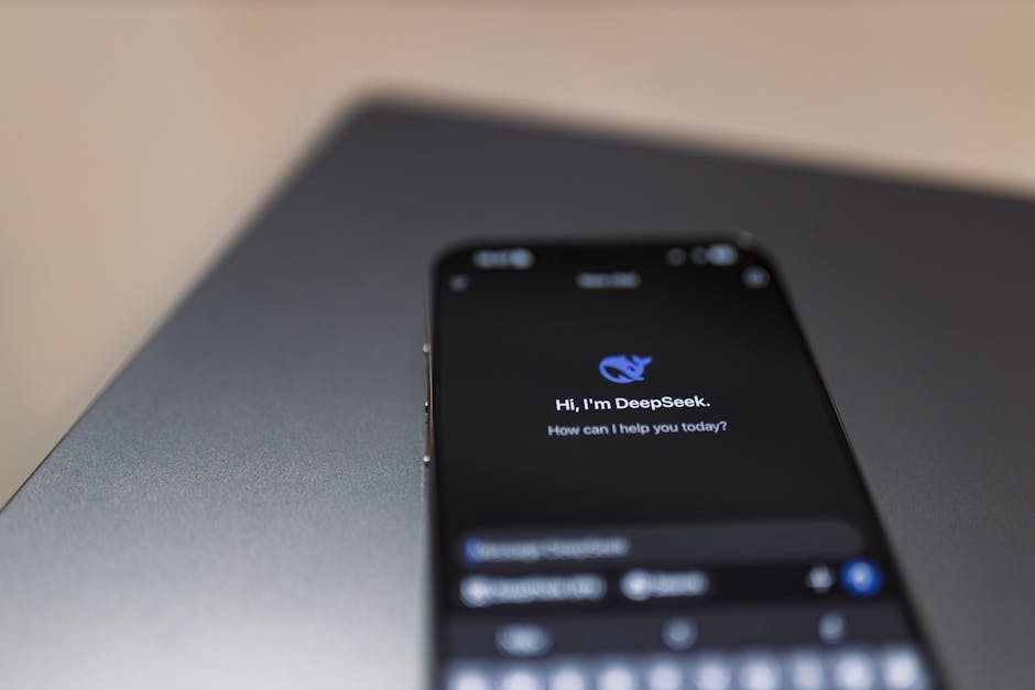Smartphone screen showing 'DeepSeek' AI chatbot with greeting, representing artificial intelligence solutions for small businesses.